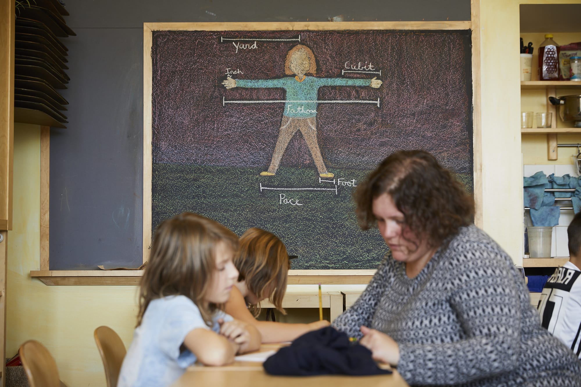 Teacher helping a student in the classroom